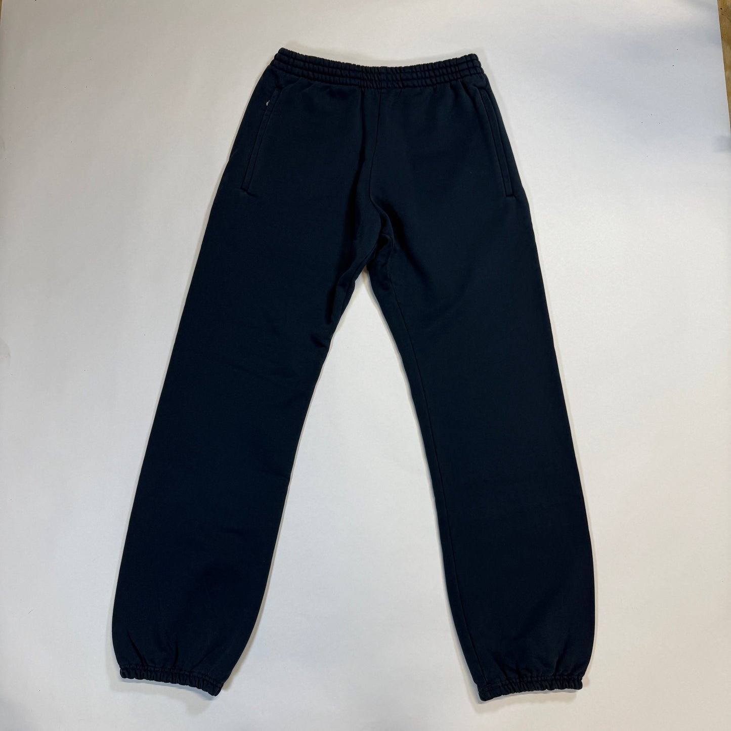 Yeezy Gap Dark Blue Fleece Cuffed Jogger Sweatpants, Cozy dark blue fleece joggers with a tapered cuffed fit. Designed by Yeezy Gap for ultimate comfort and style.