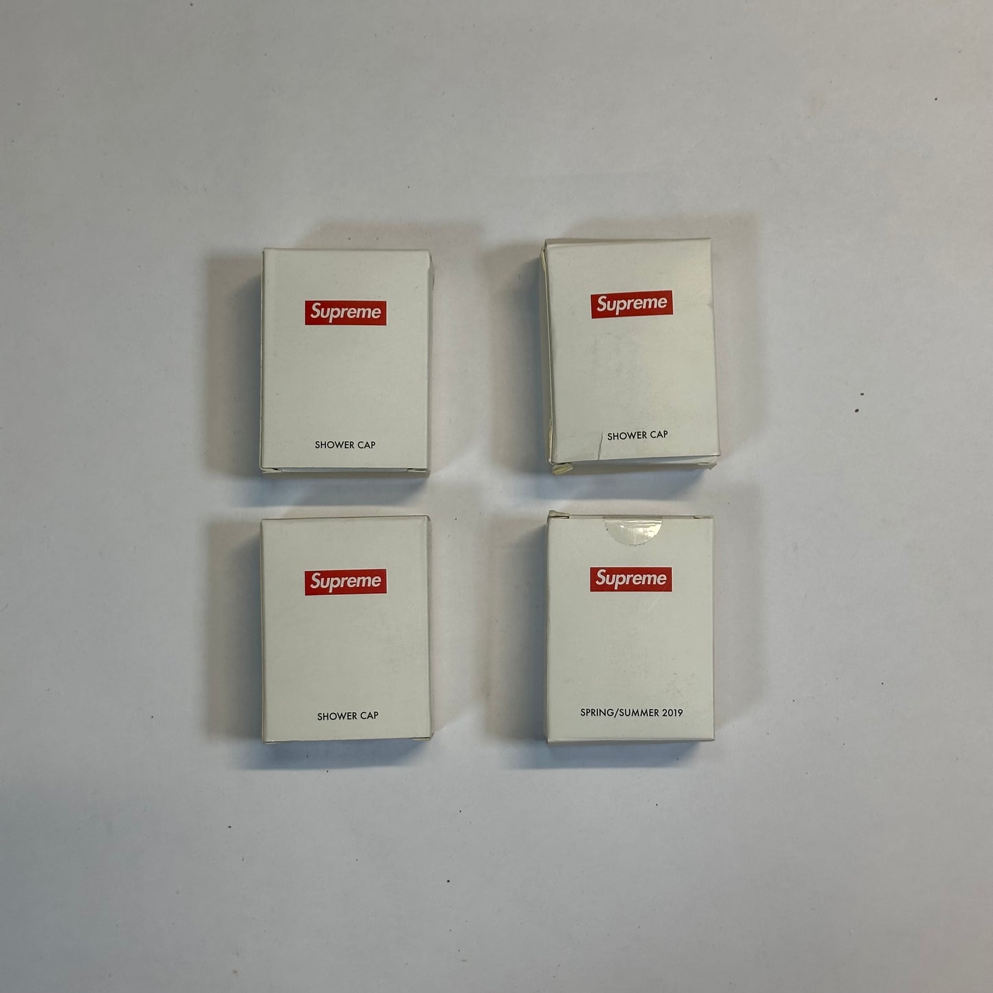 Supreme Shower Cap front of 4 Supreme shower cap packages