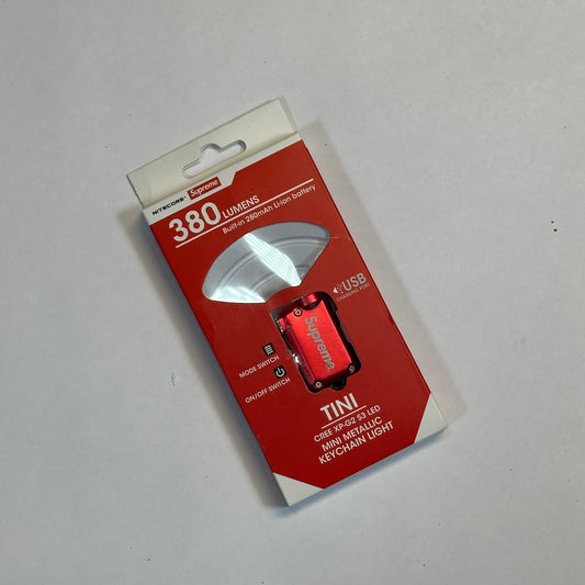 Supreme NITECORE Tini Keychain Light Red front of Nitecore keychain package