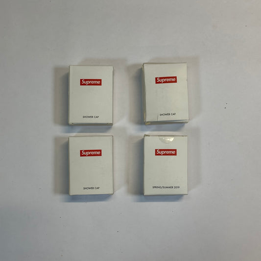 Supreme Shower Cap front of 4 Supreme shower cap packages